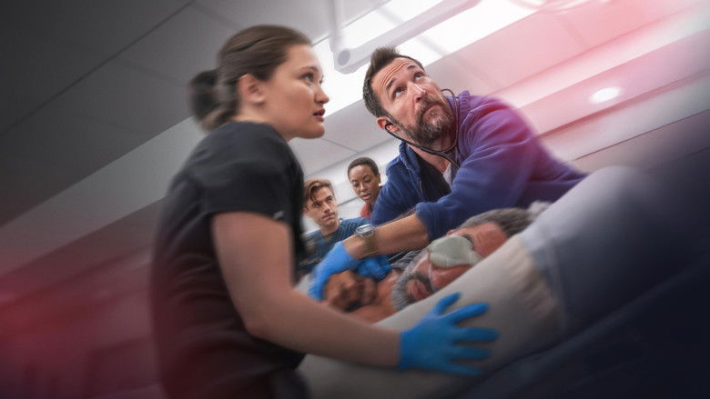 Doctors and nurses crowded around a gurney